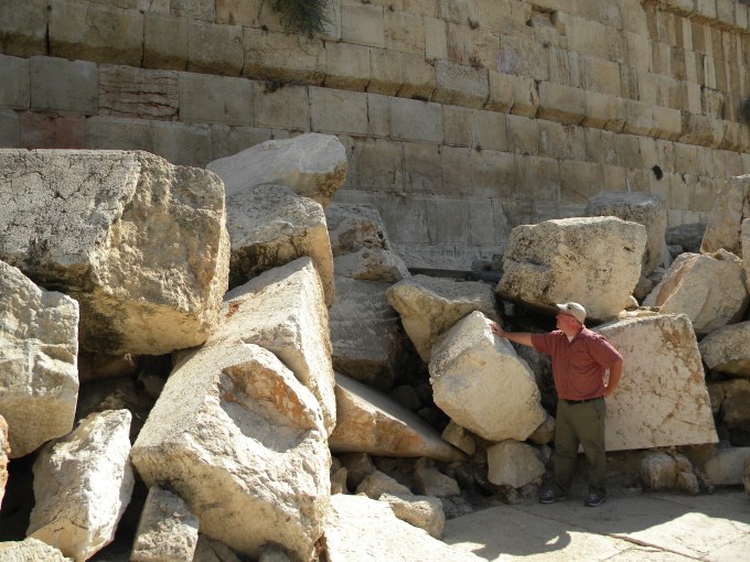 The author among large hewn stones thrown down during the destruction of the Temple in 70 C.E.